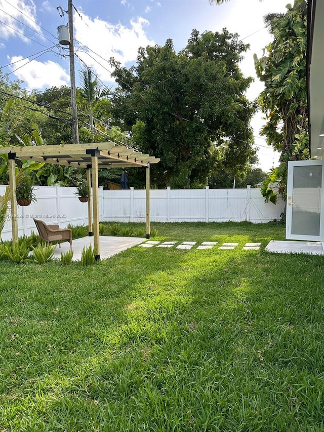 360 NE 118th St, Miami, FL 33161 - view of yard with a patio, a fenced backyard, and a pergola