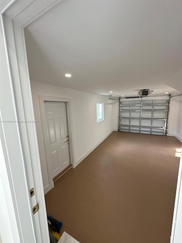 360 NE 118th St, Miami, FL 33161 - garage featuring recessed lighting, baseboards, and a garage door opener