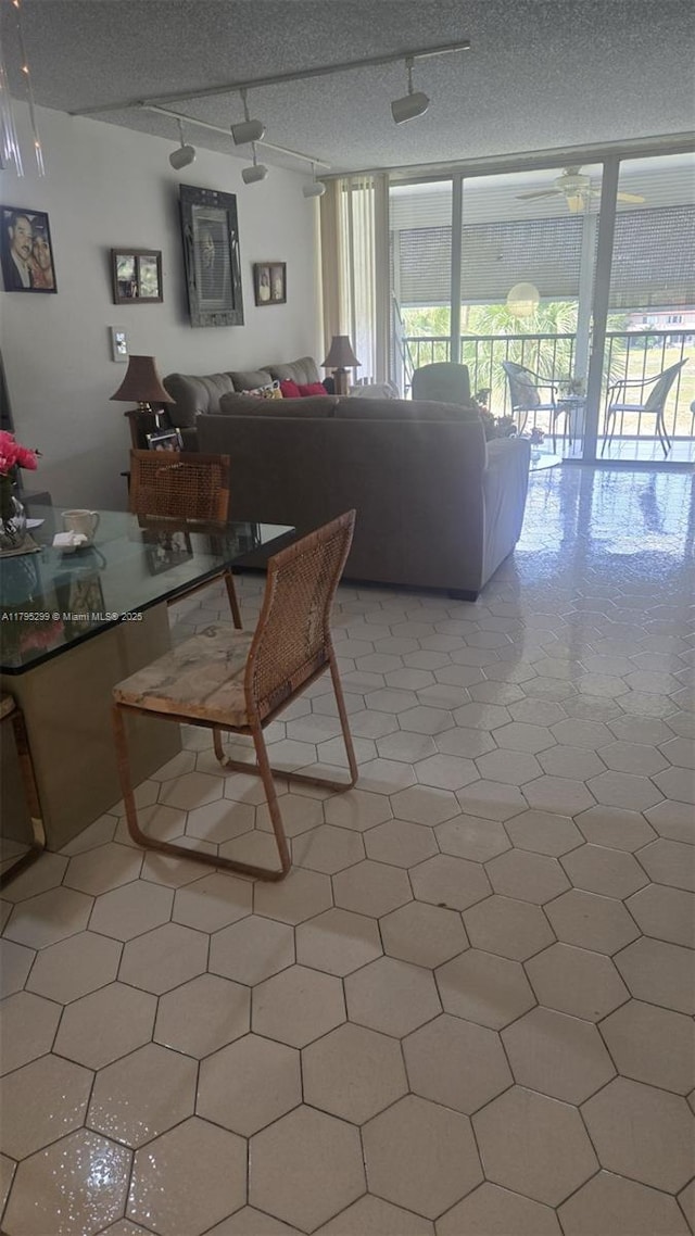3841 Environ Blvd Unit 430, Lauderhill, FL 33319 - dining area with a wall of windows and track lighting