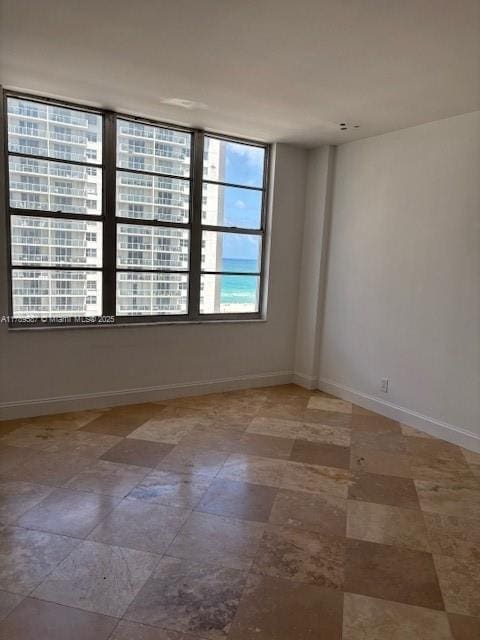 empty room with baseboards