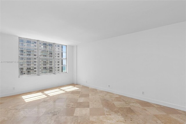 5700 Collins Ave Unit 10D, Miami Beach, FL 33140 - bathroom with vanity and tile walls