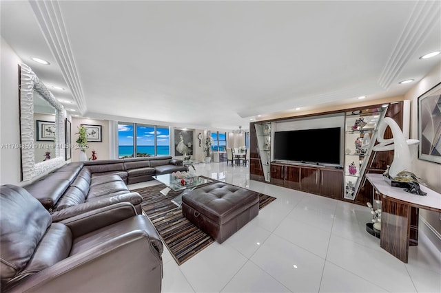 tiled living area featuring recessed lighting, a wall of windows, and a raised ceiling