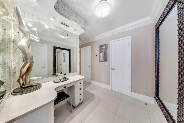 bathroom with crown molding, vanity, tile patterned floors, baseboards, and visible vents