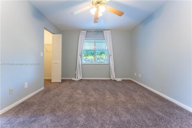 3054 NE Beechwood Cir, La Belle, FL 33935 - unfurnished bedroom with baseboards, a ceiling fan, and carpet flooring