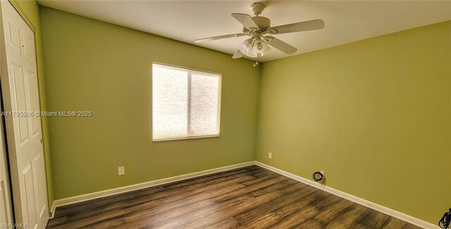 3054 NE Beechwood Cir, La Belle, FL 33935 - unfurnished room featuring baseboards, a ceiling fan, and dark wood-type flooring
