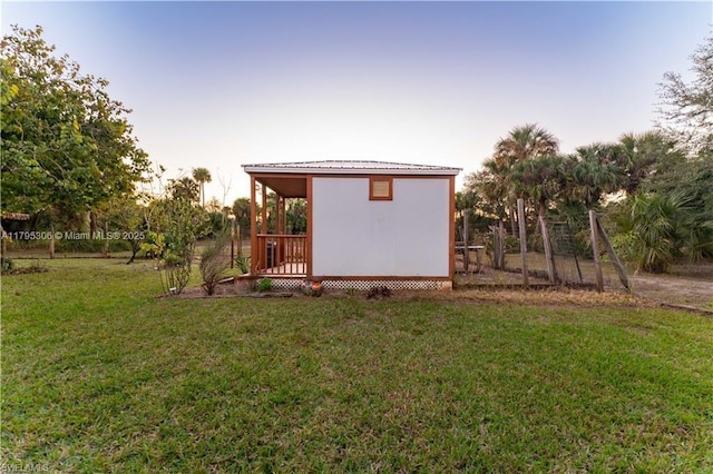 exterior space with an outbuilding and a yard