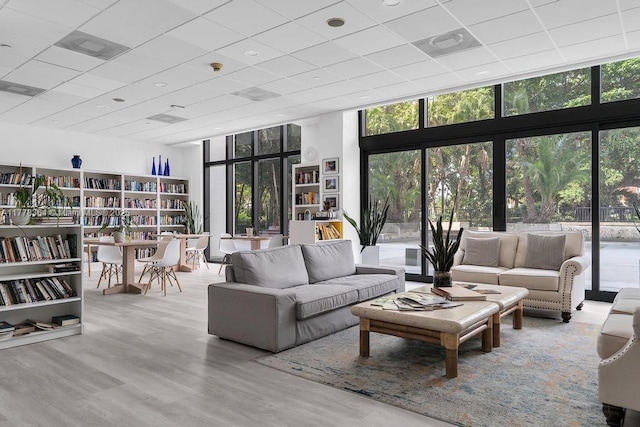 living room featuring expansive windows and wood finished floors