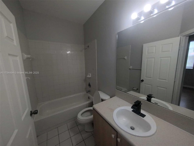 bathroom with vanity, washtub / shower combination, tile patterned floors, and toilet