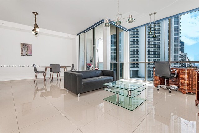 18201 Collins Ave Unit 3405, Sunny Isles Beach, FL 33160 - living room with tile patterned flooring, floor to ceiling windows, and baseboards