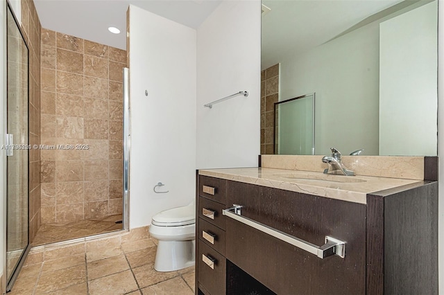 bathroom featuring toilet, recessed lighting, a shower stall, and vanity