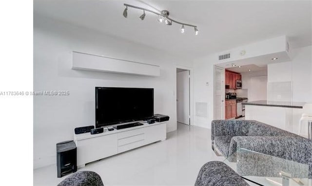 living area featuring visible vents