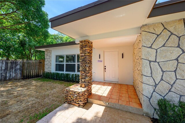 736 NE 164th St, Miami, FL 33162 - doorway to property with stone siding