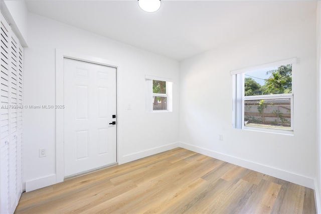 736 NE 164th St, Miami, FL 33162 - spare room with light wood-style floors and baseboards