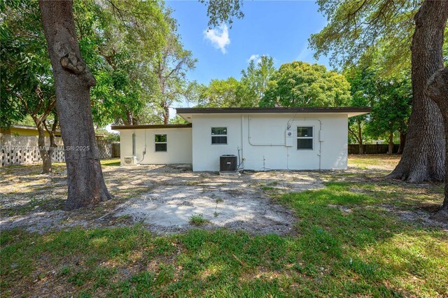 736 NE 164th St, Miami, FL 33162 - back of property featuring cooling unit and stucco siding