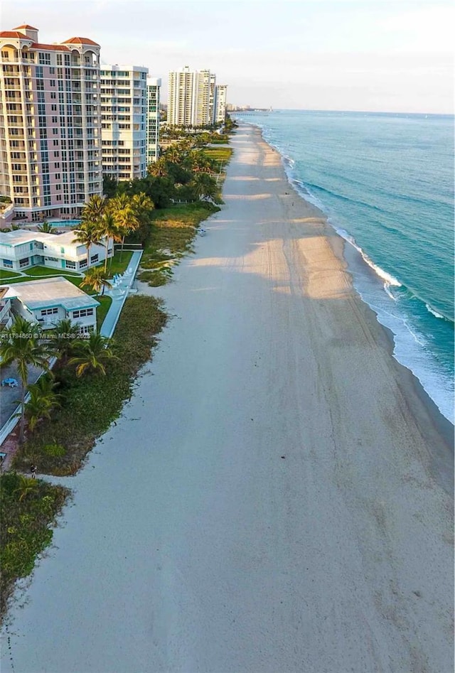 drone / aerial view with a view of the beach and a water view