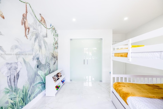 bedroom featuring recessed lighting and marble finish floor