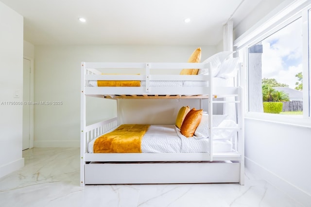bedroom with baseboards, recessed lighting, and marble finish floor