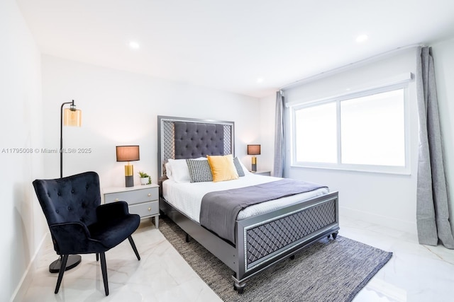 bedroom featuring recessed lighting, baseboards, and marble finish floor