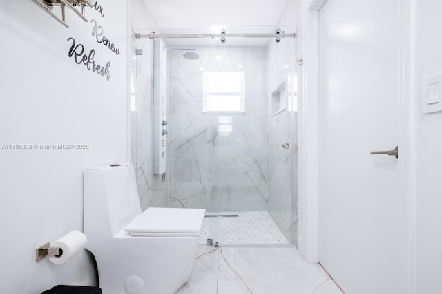 bathroom featuring toilet and a marble finish shower