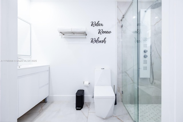 full bath with a marble finish shower, baseboards, vanity, and toilet