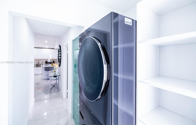 laundry area featuring laundry area and marble finish floor