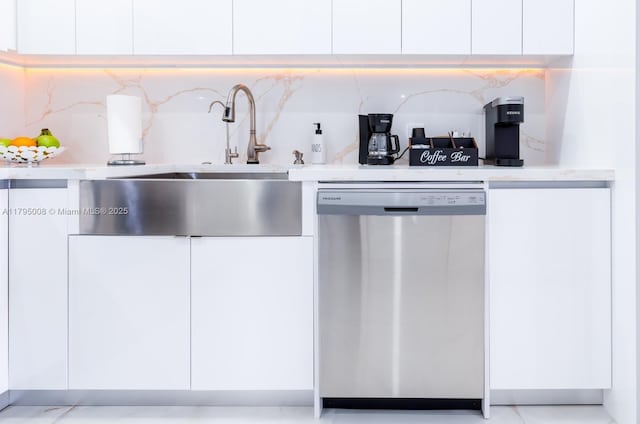 kitchen with light countertops, modern cabinets, dishwasher, and white cabinets