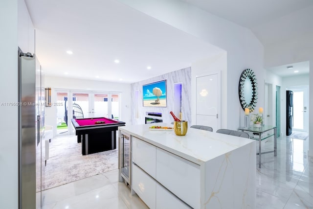interior space with french doors, recessed lighting, and wine cooler
