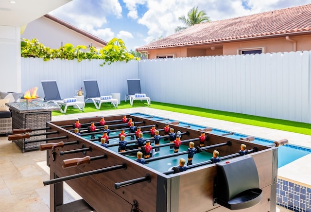 view of patio / terrace featuring fence