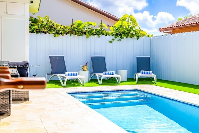 view of pool featuring a patio, fence, and a fenced in pool