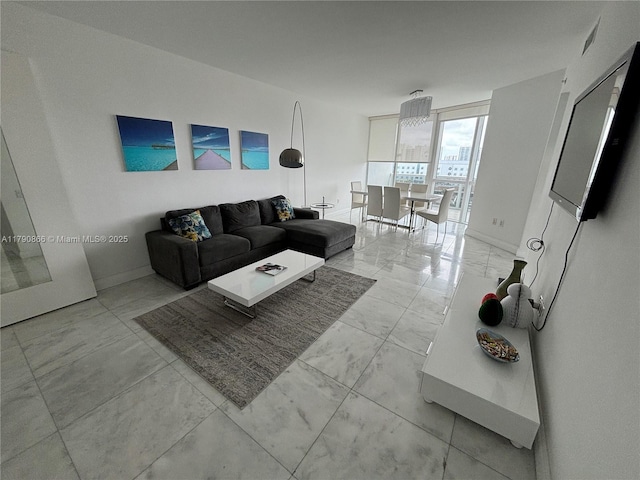 living room featuring marble finish floor