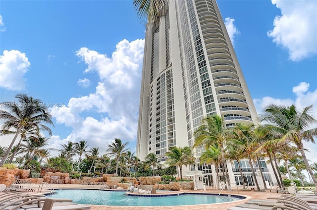 community pool with a patio area