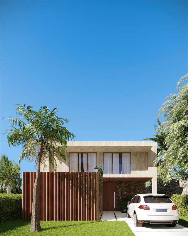 view of front facade featuring fence and stone siding