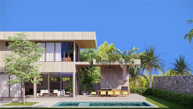 rear view of house with an outdoor living space, a patio area, an outdoor pool, and a balcony