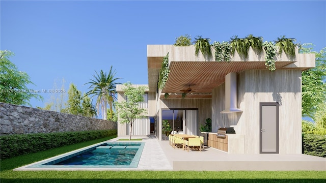 rear view of house featuring a ceiling fan and a patio area