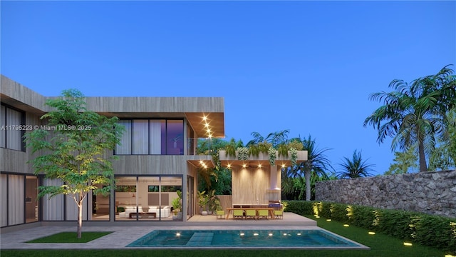 back of property with outdoor lounge area, a balcony, a patio area, and an outdoor pool