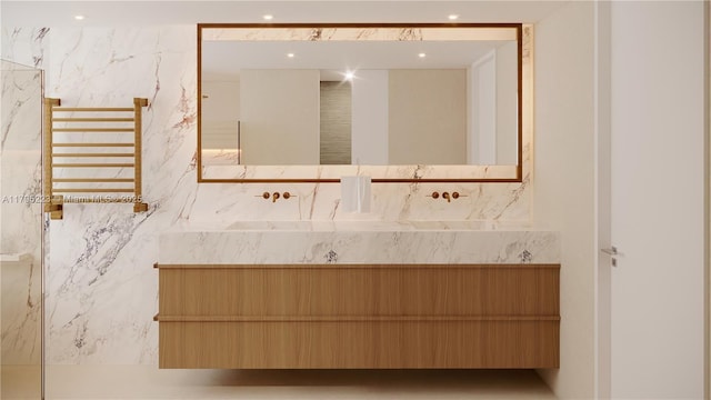 bathroom with recessed lighting, radiator, and vanity