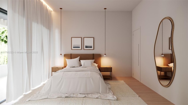 bedroom featuring multiple windows and wood finished floors