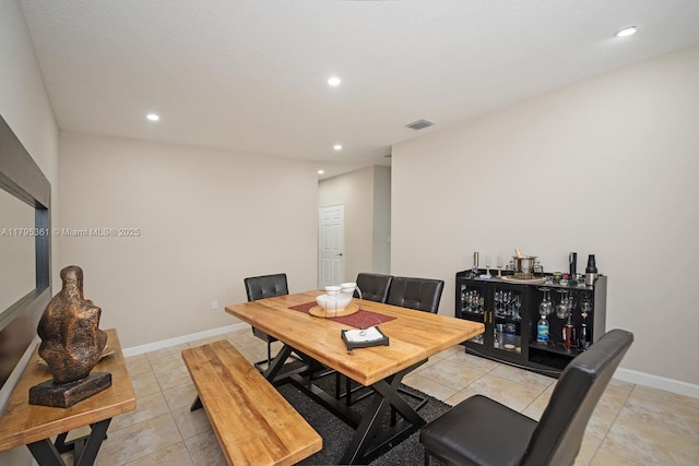 dining room with baseboards, recessed lighting, visible vents, and light tile patterned flooring