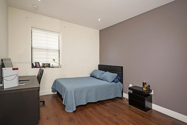 bedroom featuring baseboards, recessed lighting, and wood finished floors