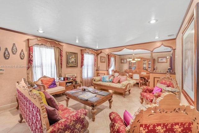 living room featuring crown molding, tile patterned flooring, an inviting chandelier, and visible vents