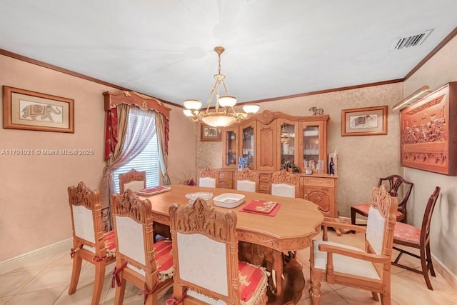 dining area featuring crown molding, a notable chandelier, visible vents, and light tile patterned floors