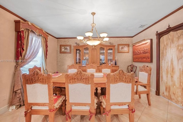 dining room featuring a notable chandelier, ornamental molding, light tile patterned floors, and visible vents