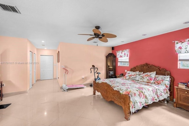 bedroom featuring ceiling fan, visible vents, light tile patterned floors, baseboards, and recessed lighting