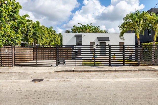 view of gate featuring a fenced front yard