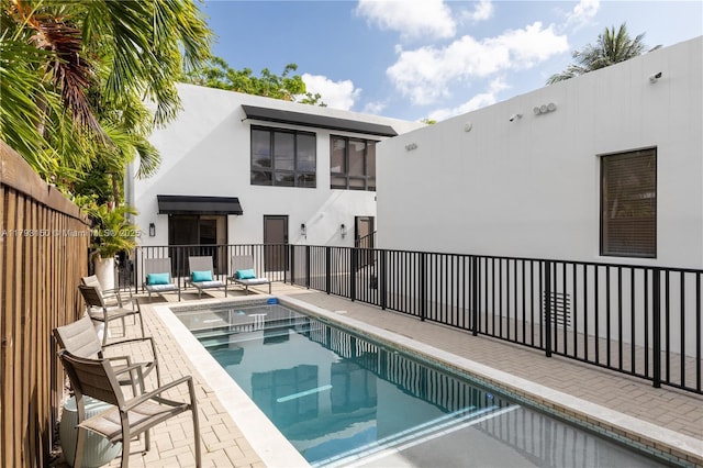 view of pool with fence, a fenced in pool, and a patio area