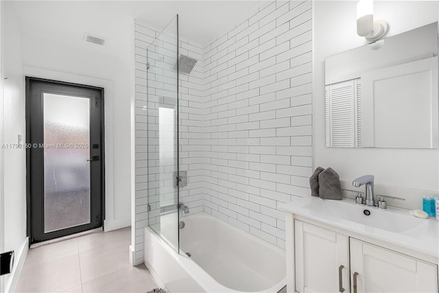 full bath with tile patterned flooring, bathing tub / shower combination, vanity, and visible vents