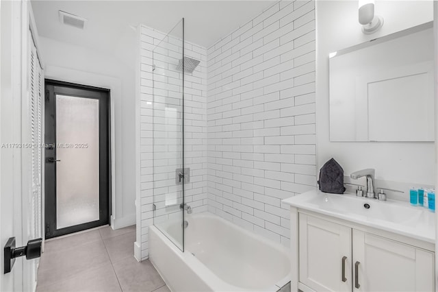 full bathroom with tile patterned flooring,  shower combination, visible vents, and vanity
