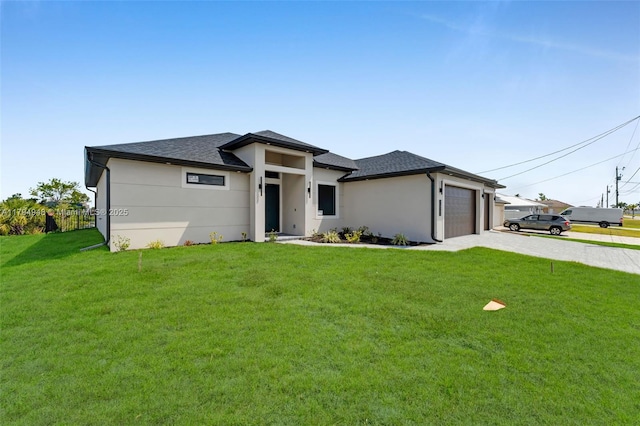 1427 NW 17th St, Cape Coral, FL 33993 - prairie-style home featuring an attached garage, a shingled roof, a front lawn, and driveway