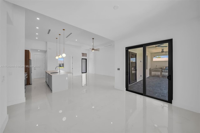 1427 NW 17th St, Cape Coral, FL 33993 - unfurnished living room featuring recessed lighting, a sink, and ceiling fan