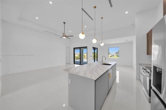 1427 NW 17th St, Cape Coral, FL 33993 - kitchen featuring a sink, a kitchen island with sink, stainless steel appliances, recessed lighting, and modern cabinets